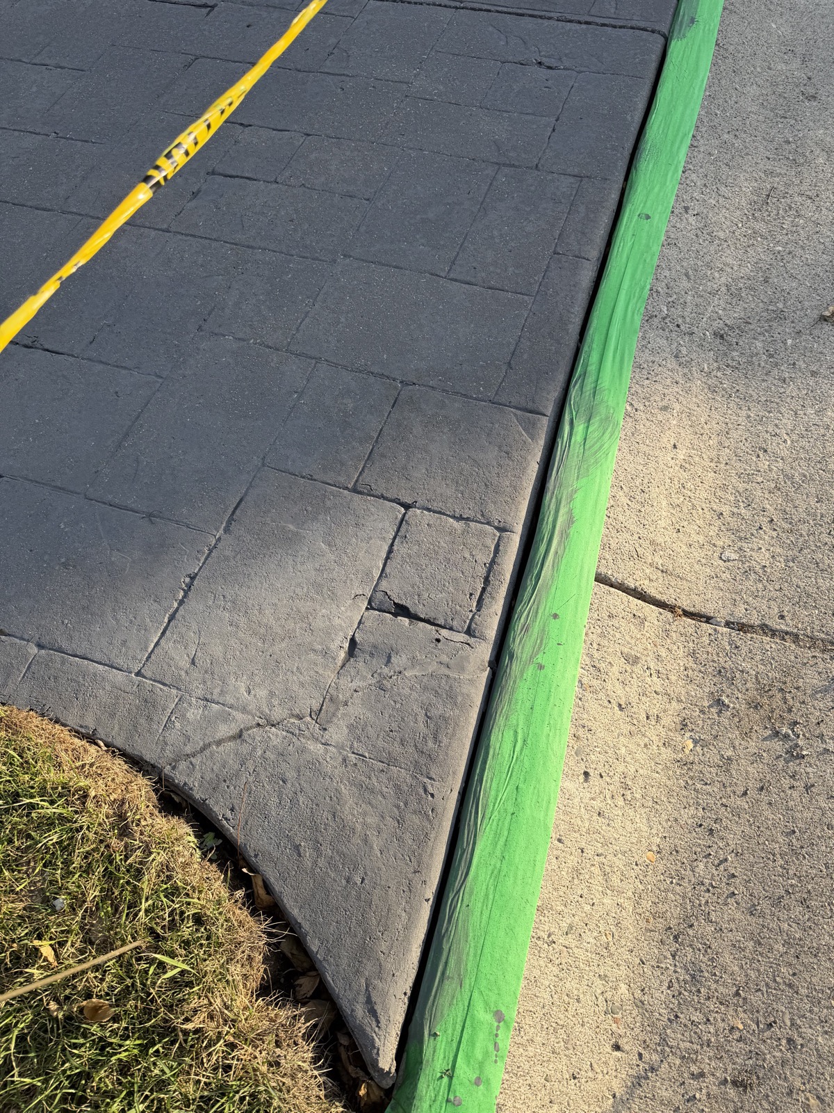 Stamped concrete walkway after crack repair and sealing