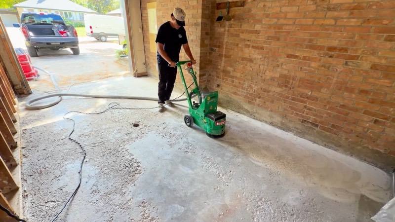 Great Blue crew diamond-grinding a garage floor with a floor grinder
