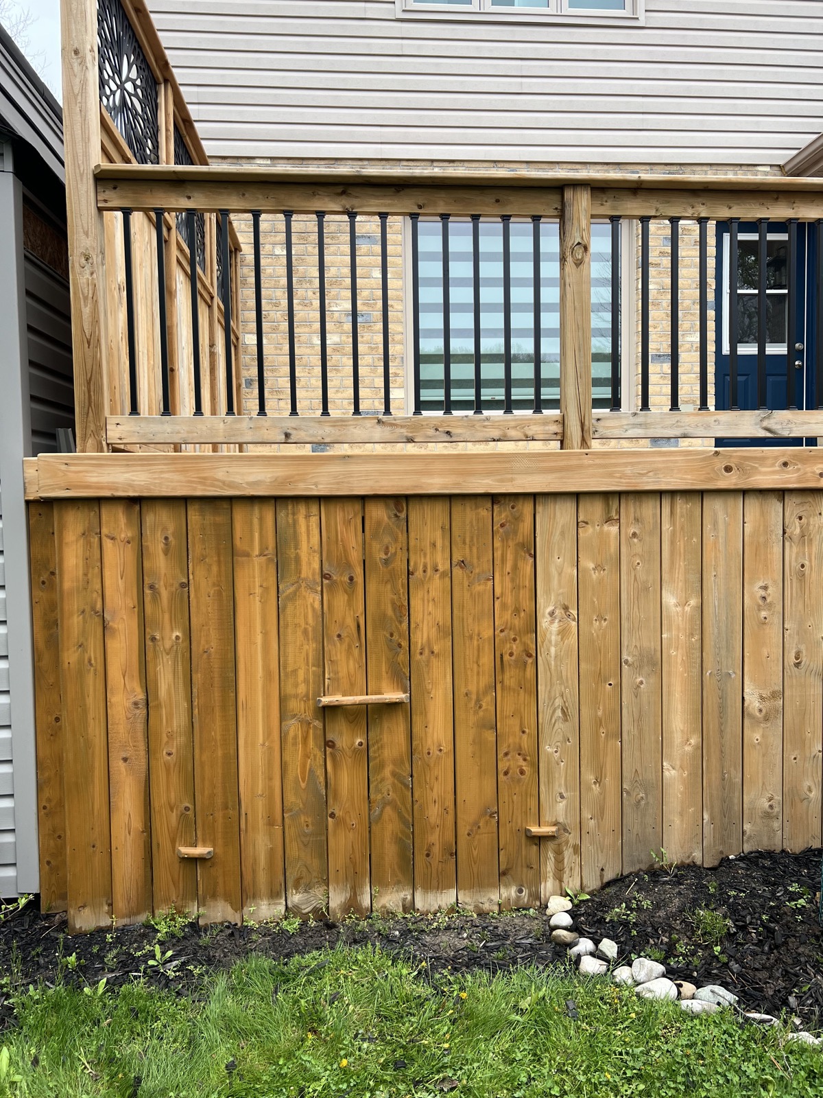 Restored cedar deck and privacy skirting after cleaning and staining